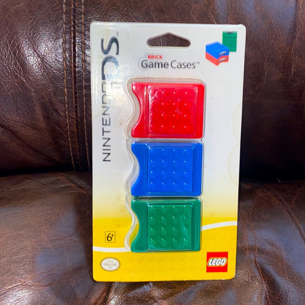 NEW 3 Nintendo DS Lego Brick Game Cases in red, green and blue.